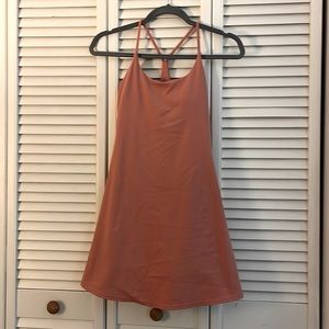 Athletic dress, built in under shorts with side pockets, built in bra with pads